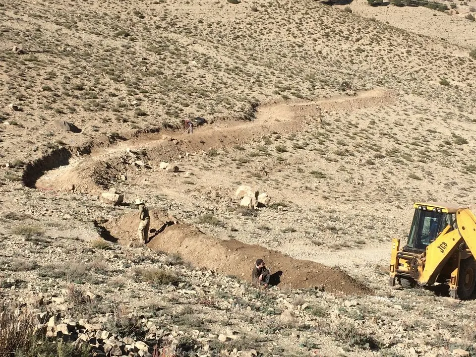 Water harvesting earthworks under construction in the High Atlas, Morocco