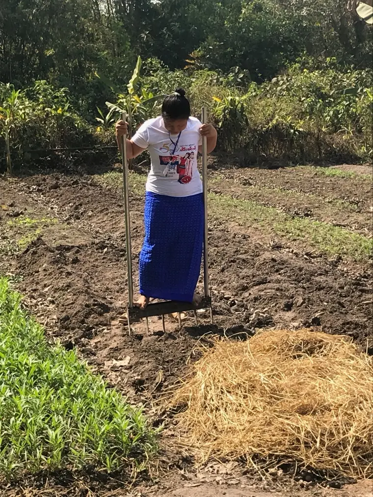Participant practising contour marking with an A-frame during community training