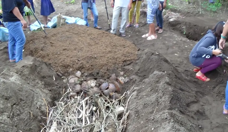 Participants learning compost and soil-building methods during the ADRA EMBRACE program