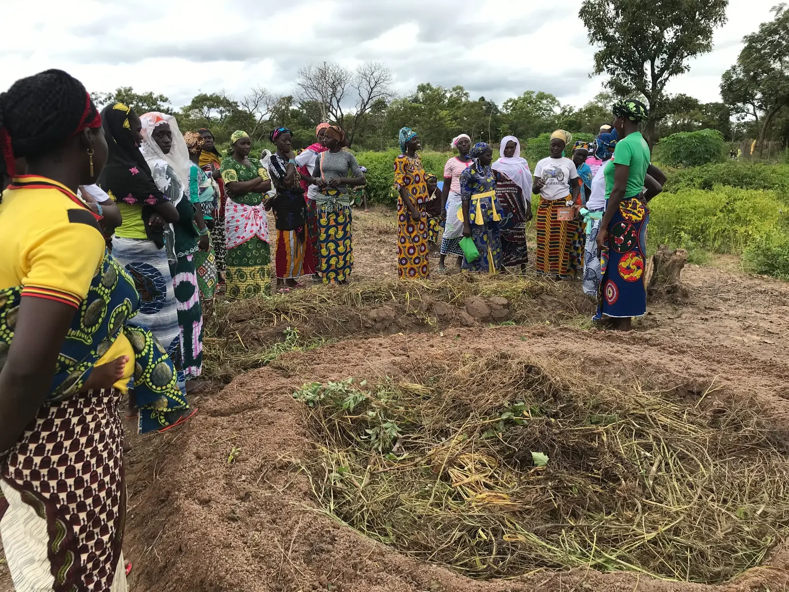 Women participating in practical garden training connected with a mining-funded community program in Africa