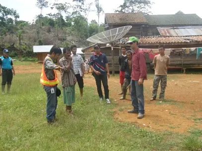 Community members taking part in field training near a mining operation in Sumatra