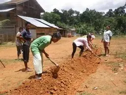 Local participants undertaking practical garden preparation in Sumatra